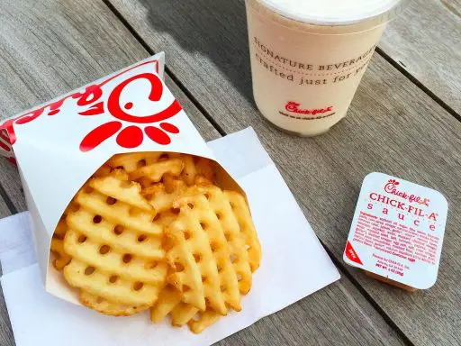 chick-fil-a waffle fries with chick-fil-a sauce and beverage