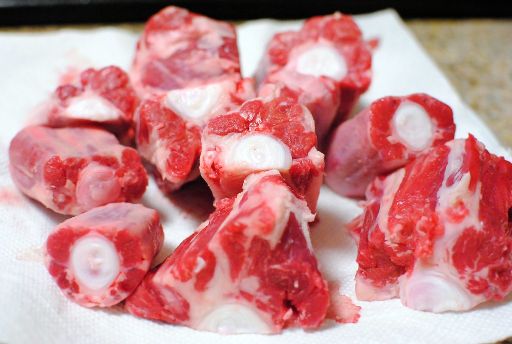 raw slices of oxtail placed on a tissue paper