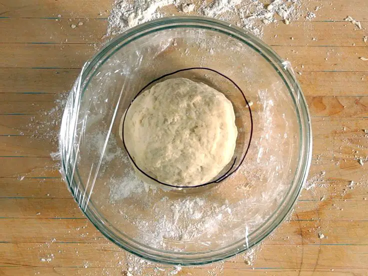 dough in a bowl covered with plastic wrap - is it necessary to cover the dough
