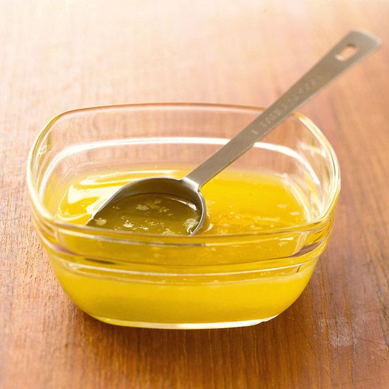 melted butter in a small bowl with a spoon 