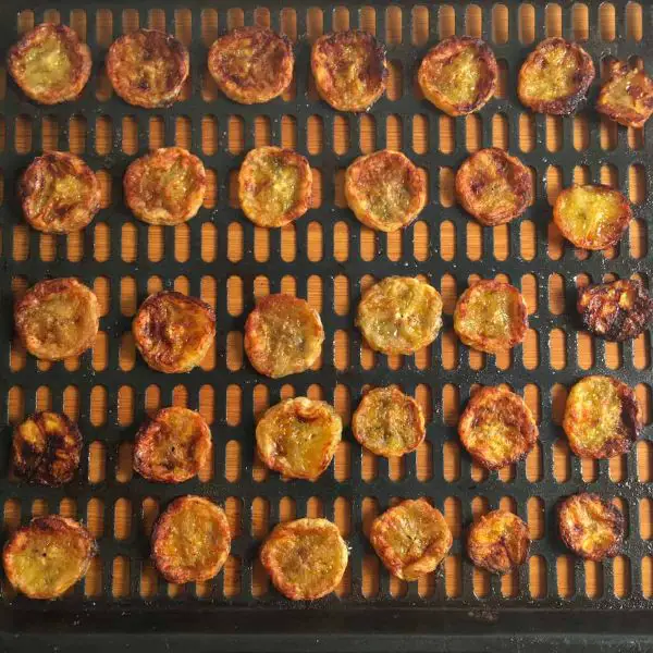 banana chips on the air fryer basket tray-Dehydrating Bananas in an Air Fryer 