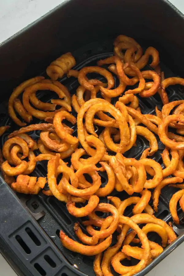curly fries in the air fryer basket 